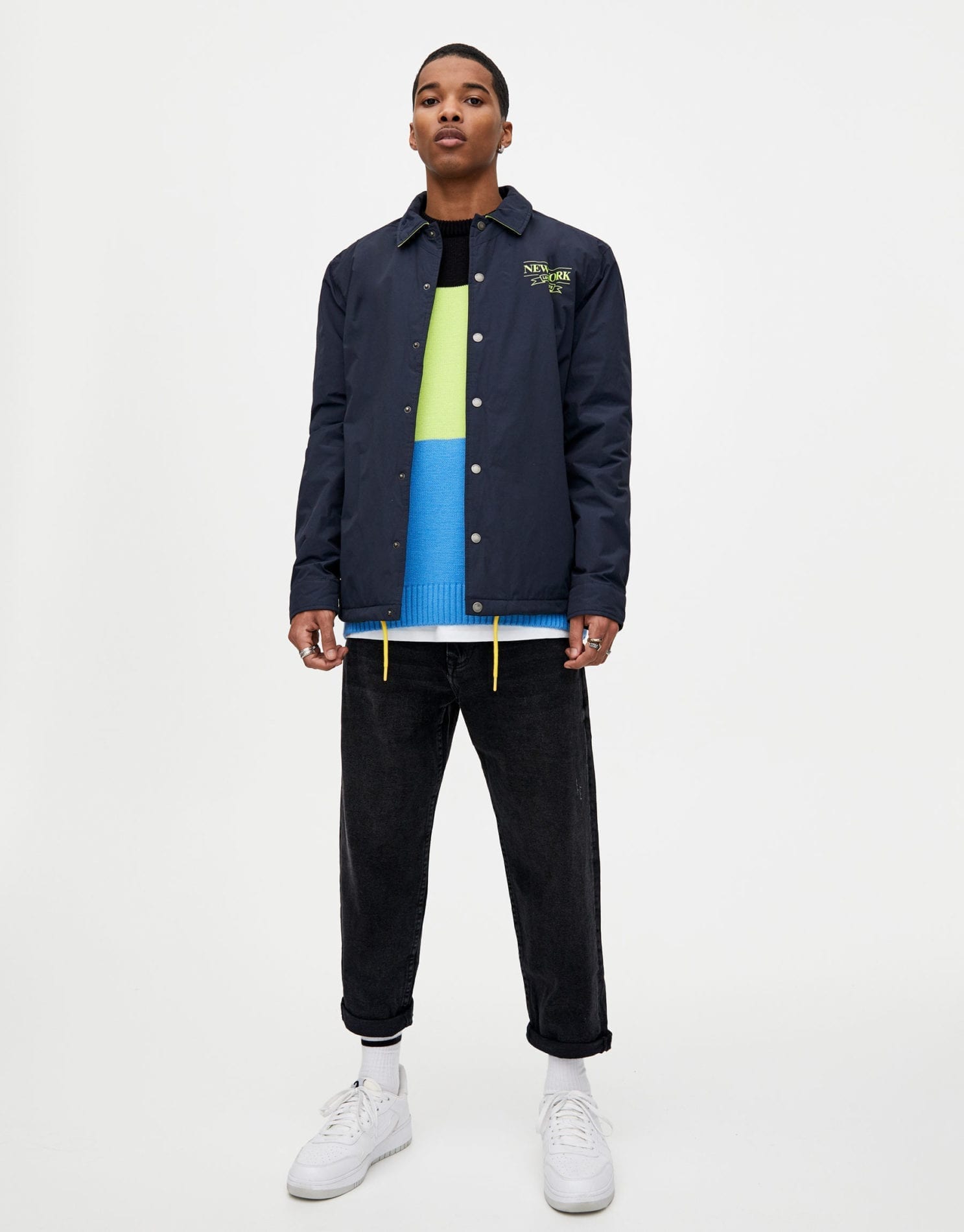 Navy blue coach jacket with neon detail